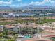 Stunning aerial view of resort with a large pool, palm trees, and luxury accommodations at 7734 E Monica Dr, Scottsdale, AZ 85255