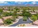 Beautiful aerial view of the neighborhood showcasing well-maintained homes and lush green landscaping at 7734 E Monica Dr, Scottsdale, AZ 85255