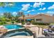 Beautiful backyard featuring a pool, hot tub, patio and views of lush landscaping at 7734 E Monica Dr, Scottsdale, AZ 85255