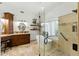Primary bathroom with a standalone tub, tiled shower with glass, and a dark wood double vanity at 7734 E Monica Dr, Scottsdale, AZ 85255