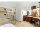 Elegant bathroom featuring tiled shower and vanity with ample storage at 7734 E Monica Dr, Scottsdale, AZ 85255