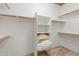 Closet with custom shelving and wood racks at 7734 E Monica Dr, Scottsdale, AZ 85255