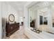Bright foyer featuring travertine floors and a wooden console table with decor at 7734 E Monica Dr, Scottsdale, AZ 85255