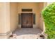 Impressive double front door with sidelights and a transom window offering a grand entrance to the home at 7734 E Monica Dr, Scottsdale, AZ 85255