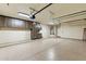 Garage with cabinets and epoxy floor for optimal organization and cleanliness at 7734 E Monica Dr, Scottsdale, AZ 85255