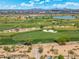 Expansive golf course with lush green fairways, sand traps, and scenic views under a blue sky at 7734 E Monica Dr, Scottsdale, AZ 85255