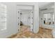 Bright hallway featuring tile flooring and views into multiple rooms, creating an inviting atmosphere at 7734 E Monica Dr, Scottsdale, AZ 85255