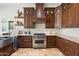 This spacious kitchen showcases a Viking oven, custom wood cabinets, and stone countertops at 7734 E Monica Dr, Scottsdale, AZ 85255
