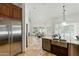 Open-concept kitchen with stainless steel appliances and a dining nook, perfect for modern living at 7734 E Monica Dr, Scottsdale, AZ 85255