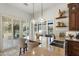 Stunning kitchen featuring stone countertops, a white flower display, and abundant natural light from shuttered windows at 7734 E Monica Dr, Scottsdale, AZ 85255