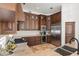 Gourmet kitchen features custom cabinets, stainless steel appliances, and granite countertops at 7734 E Monica Dr, Scottsdale, AZ 85255