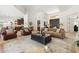 Spacious living room with tile floors, neutral decor, and an open layout that seamlessly connects to the kitchen at 7734 E Monica Dr, Scottsdale, AZ 85255