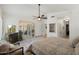 Main bedroom featuring tile floors, a ceiling fan, and access to an outdoor patio at 7734 E Monica Dr, Scottsdale, AZ 85255