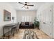 The office features a sofa, desk, and large windows, with a modern rug at 7734 E Monica Dr, Scottsdale, AZ 85255