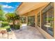 Covered patio featuring travertine flooring, offering a seamless transition between indoor and outdoor living at 7734 E Monica Dr, Scottsdale, AZ 85255