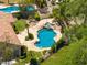 Inviting custom pool with a travertine deck, mature landscaping, and privacy fence at 7734 E Monica Dr, Scottsdale, AZ 85255