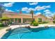 Beautiful backyard featuring a custom pool and covered patio area at 7734 E Monica Dr, Scottsdale, AZ 85255