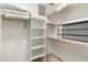 Walk-in closet offers ample storage with built-in shelving and organization system at 7734 E Monica Dr, Scottsdale, AZ 85255