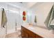 Modern bathroom with a glass-enclosed shower, single vanity, and sleek fixtures at 7854 W Tether Trl, Peoria, AZ 85383