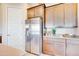 Stainless steel refrigerator and modern cabinets complement this beautiful kitchen space at 7854 W Tether Trl, Peoria, AZ 85383