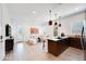 Bright and airy living room with a kitchen island, white sofa, and modern decor at 7854 W Tether Trl, Peoria, AZ 85383