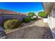 Well-maintained backyard featuring manicured bushes and a rock garden at 7916 E Naranja Ave, Mesa, AZ 85209