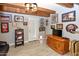Finished basement featuring tile flooring, exposed beams, and sports memorabilia decorations at 7916 E Naranja Ave, Mesa, AZ 85209
