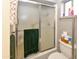 Bathroom featuring a shower with glass doors and a green towel hanging on the door at 7916 E Naranja Ave, Mesa, AZ 85209