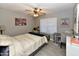 Bedroom featuring a ceiling fan, desk, and a comfortable bed, perfect for relaxation and productivity at 7916 E Naranja Ave, Mesa, AZ 85209