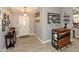 Warm entryway featuring tile flooring, neutral walls adorned with pictures, and a rustic-style bar at 7916 E Naranja Ave, Mesa, AZ 85209