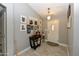 Welcoming entryway with tile flooring, gray walls adorned with pictures, and stylish decorations at 7916 E Naranja Ave, Mesa, AZ 85209