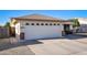 A spacious two-car garage with a white door and a well-kept driveway, offering ample parking space at 7916 E Naranja Ave, Mesa, AZ 85209