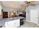 Open concept kitchen and dining area with stainless steel appliances and wood-look tile flooring at 7916 E Naranja Ave, Mesa, AZ 85209