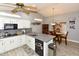 Bright kitchen with gray countertops, stainless appliances, and dining area at 7916 E Naranja Ave, Mesa, AZ 85209