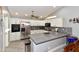 Updated kitchen featuring stainless steel appliances, white cabinets and gray countertops at 7916 E Naranja Ave, Mesa, AZ 85209