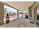 Covered back patio with exterior lighting and room to entertain at 8871 W Maryland Ave, Glendale, AZ 85305
