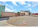 Spacious gravel backyard with stone walkway and privacy wall at 8871 W Maryland Ave, Glendale, AZ 85305