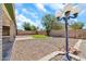 Well maintained backyard with grass area and exterior lighting at 8871 W Maryland Ave, Glendale, AZ 85305