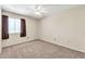 Bedroom featuring carpet, ceiling fan, blinds, and neutral colored walls at 8871 W Maryland Ave, Glendale, AZ 85305