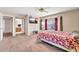 Spacious bedroom with a bay window, ceiling fan, and television above the bed at 8871 W Maryland Ave, Glendale, AZ 85305