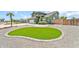 Manicured lawn with unique design and gravel adding curb appeal to this well-maintained home at 8871 W Maryland Ave, Glendale, AZ 85305