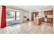 Well-lit kitchen offering an island, stainless steel appliances, ample natural light, and seamless access to the backyard at 8871 W Maryland Ave, Glendale, AZ 85305