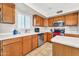 Bright kitchen features tile floors, stainless steel appliances, and an island for ample workspace at 8871 W Maryland Ave, Glendale, AZ 85305