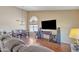 Bright living room with vaulted ceiling, wood floor, and open floor plan offering space and comfort at 8871 W Maryland Ave, Glendale, AZ 85305