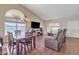 Inviting living room featuring wood floors, vaulted ceilings and an open floor plan, perfect for relaxation and entertaining at 8871 W Maryland Ave, Glendale, AZ 85305