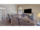 Comfortable living room with wood flooring, vaulted ceilings, an open layout and comfortable seating for relaxation at 8871 W Maryland Ave, Glendale, AZ 85305