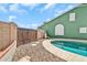 The backyard has a private in-ground swimming pool and low-maintenance rock landscaping at 8871 W Maryland Ave, Glendale, AZ 85305