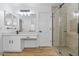 Beautiful bathroom featuring a vanity, mirror, shower, and tile surround at 9343 W Harmony Ln, Peoria, AZ 85382