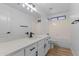 This is a clean bathroom with wood floors, a shower, and a sink at 9343 W Harmony Ln, Peoria, AZ 85382