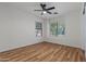 Large bedroom with hardwood floors and multiple windows for natural light at 9343 W Harmony Ln, Peoria, AZ 85382